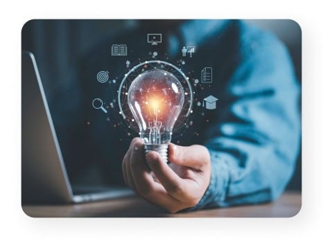 Hand holding a glowing lightbulb with digital icons, symbolizing innovative business solutions for small and medium-sized businesses.
