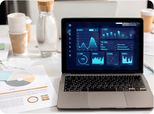 A laptop screen showing an analytics dashboard, with various data charts and performance metrics.