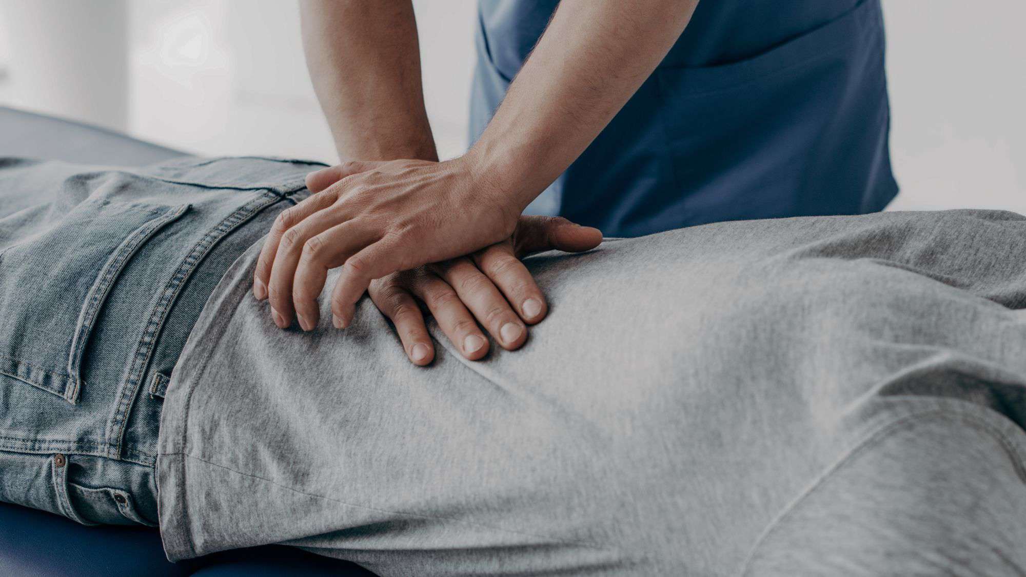 Chiropractor performing an adjustment on a patient, representing effective patient care and growth solutions for chiropractic practices.